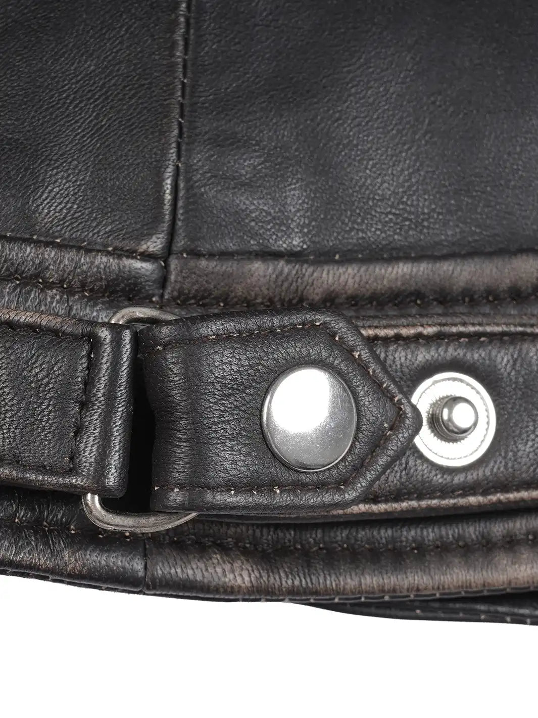 Close-up of a black leather belt with metal buckle on a white background