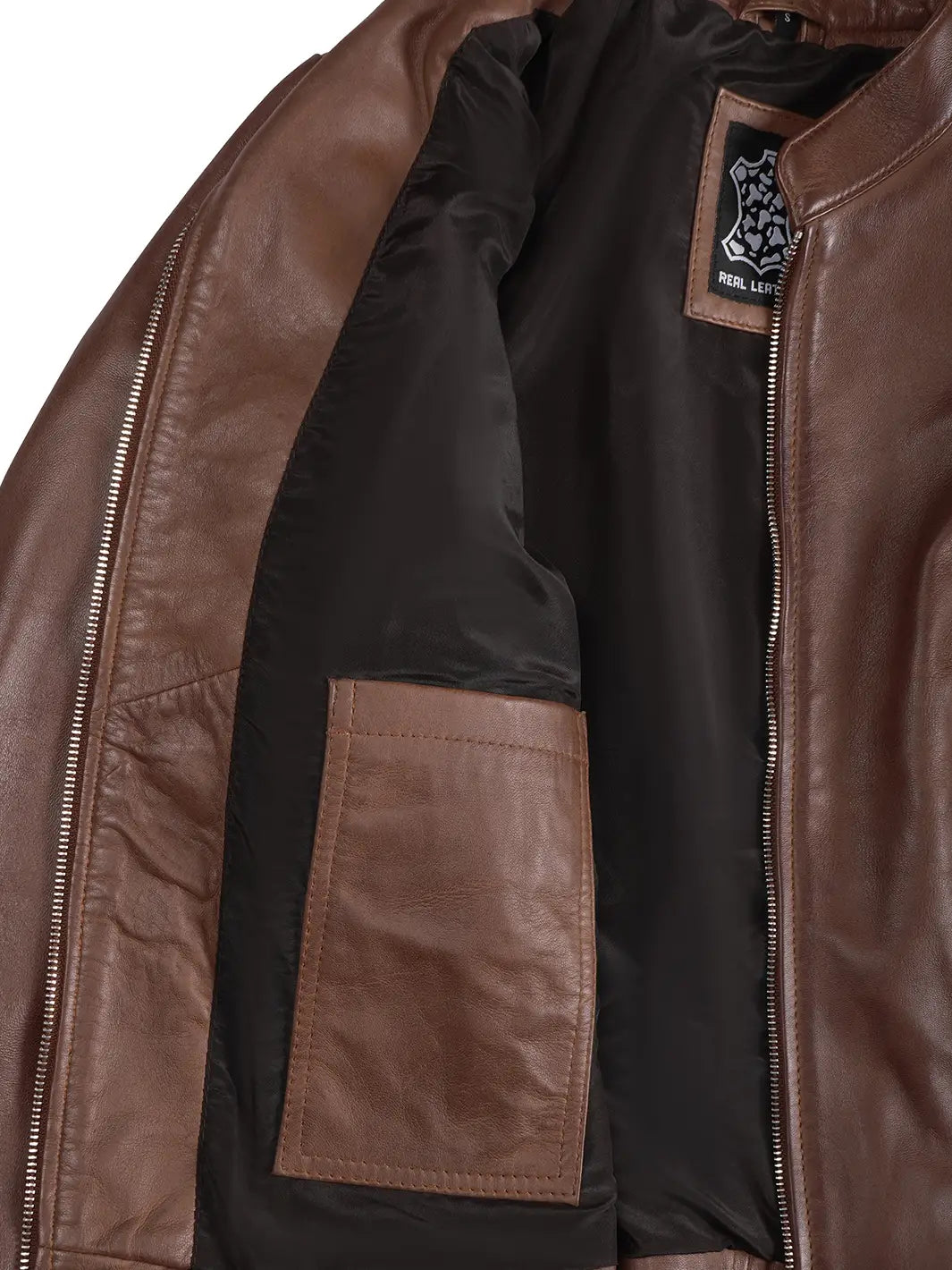 Close-up of a brown leather jacket with a brand logo on the chest.
