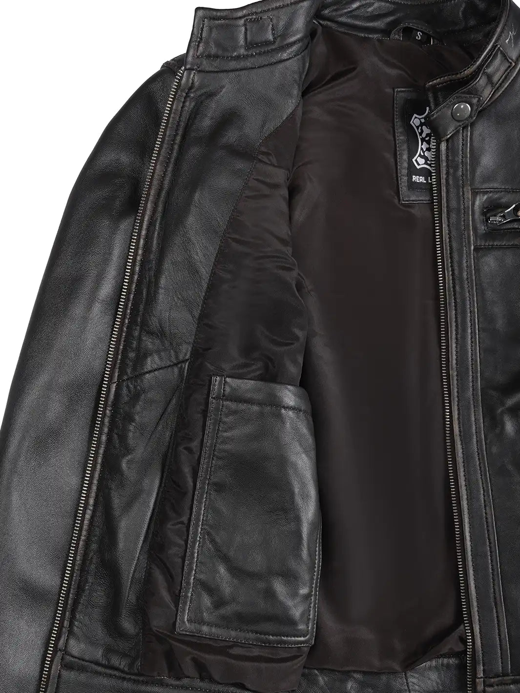 Close-up of a black leather jacket with visible branding on a white background