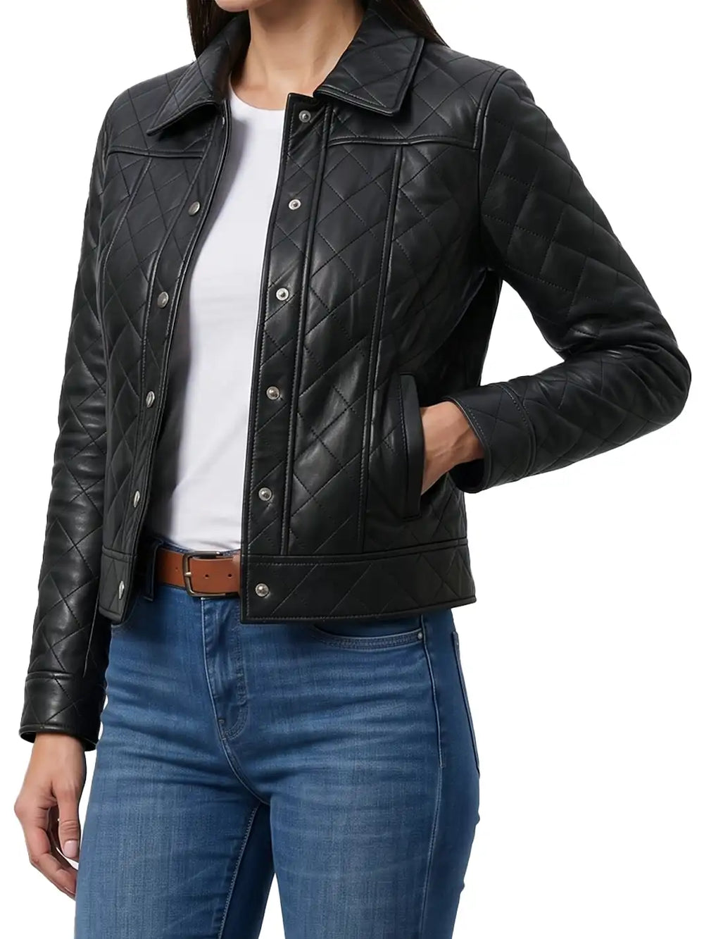 A woman wearing a black quilted leather jacket over a white top and blue jeans, shown from the neck down against a plain white background.