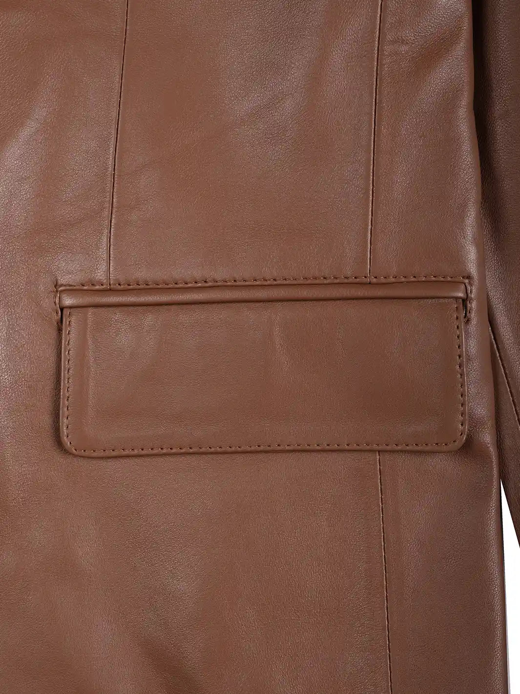 Close-up of a brown leather jacket with a pocket detail.