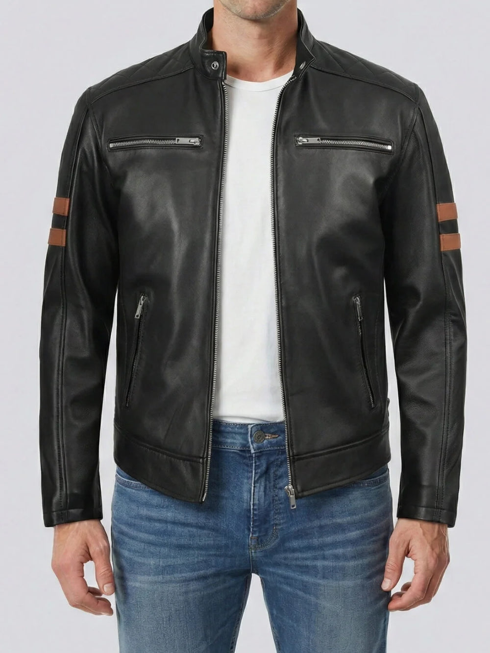 Black leather jacket with brown accents worn by a person on a white background