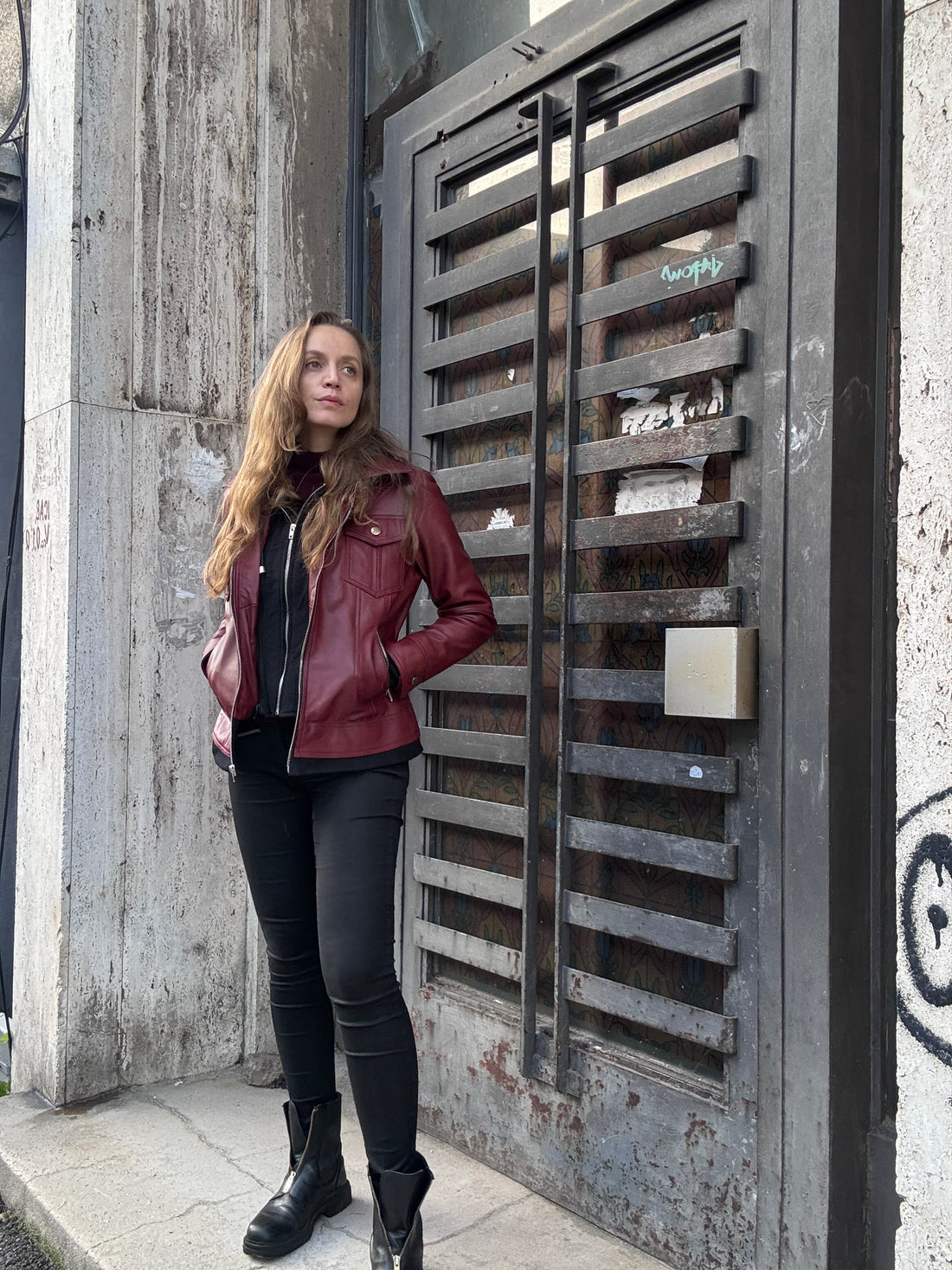 Burgundy real leather jacket in low autumn light
