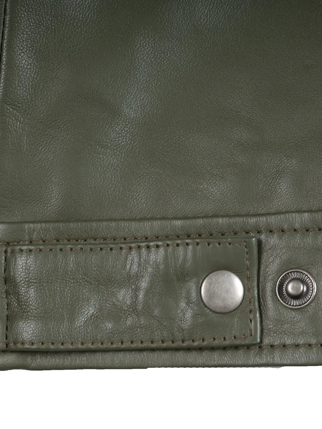 Close-up of a green leather jacket with metal buttons on a white background