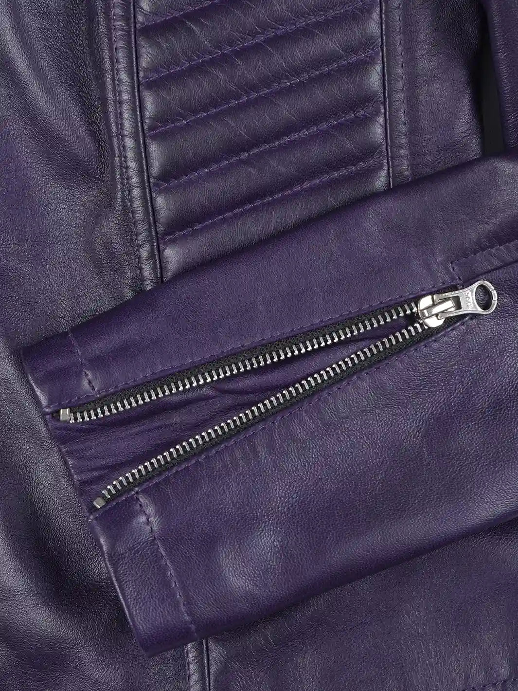 Close-up of a purple leather jacket with a zipper