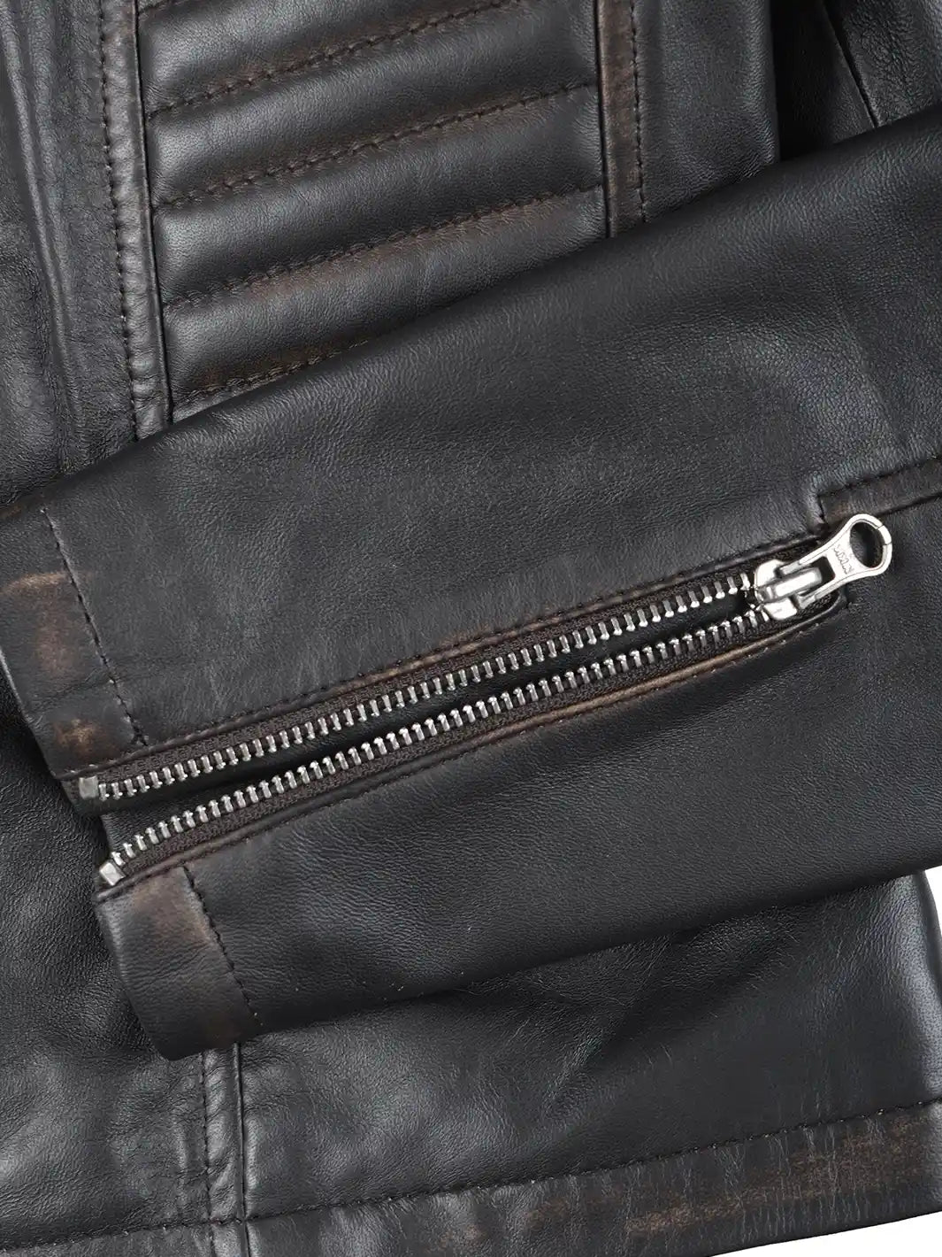 Close-up of a black leather jacket with a zipper